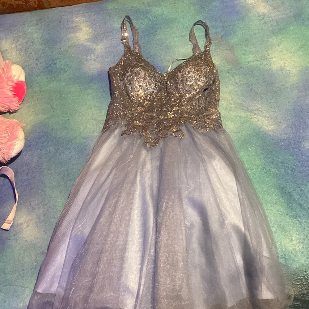 I am selling this dress because I only wore it once